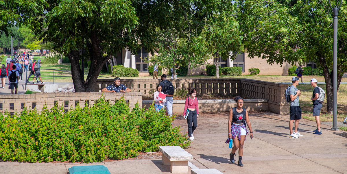 students walking on campus near MHAB