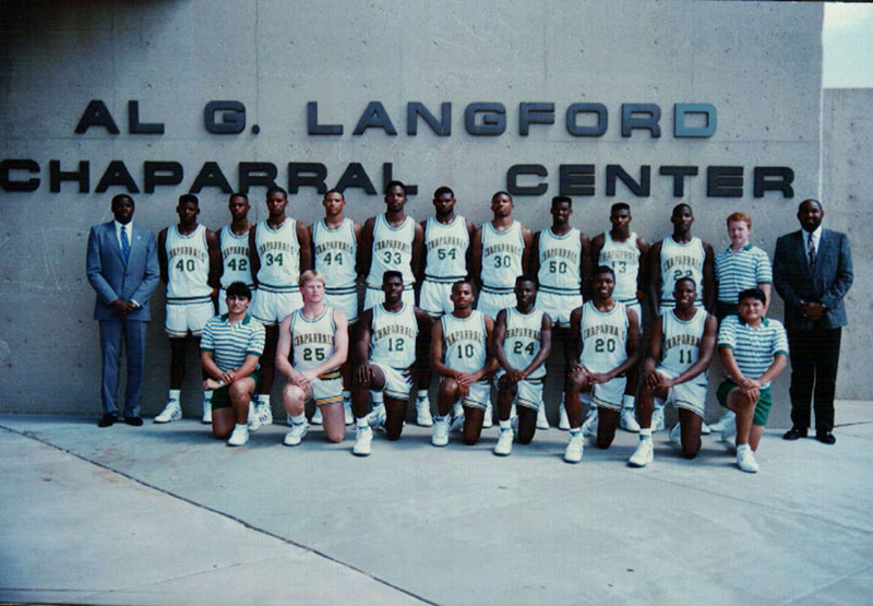 Men's basketball team standing in front of Chap Center