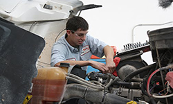 Student working on diesel engine