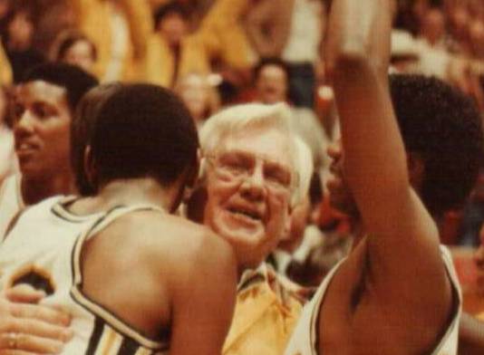 First MC President celebrates basketball game win with the team