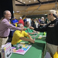 dr. todd houck shakes student's hand
