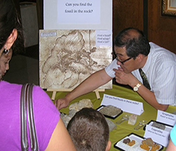 Geology instructor in community outreach at museum science night