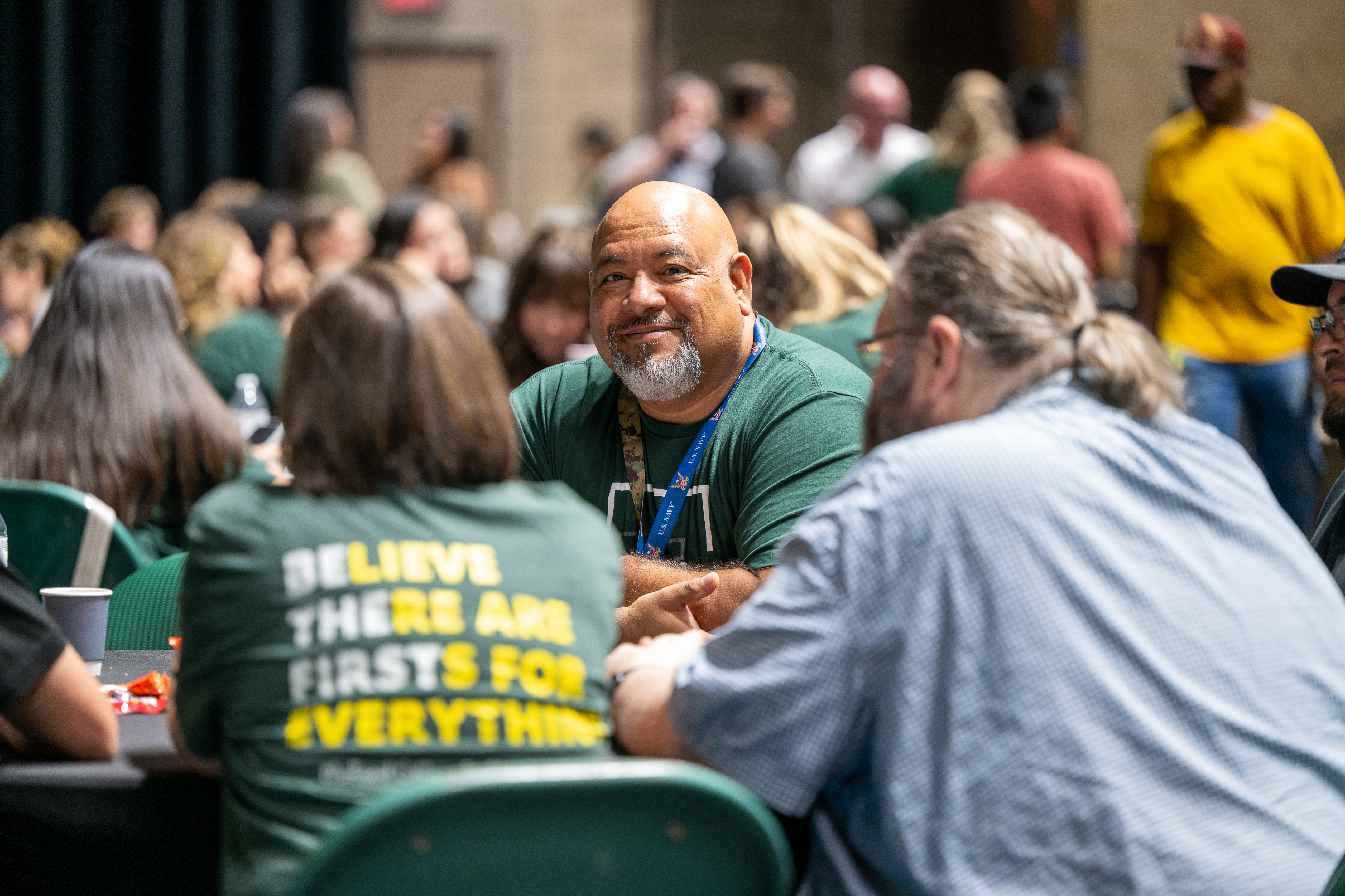 Employee smiling at Midland College's convocation