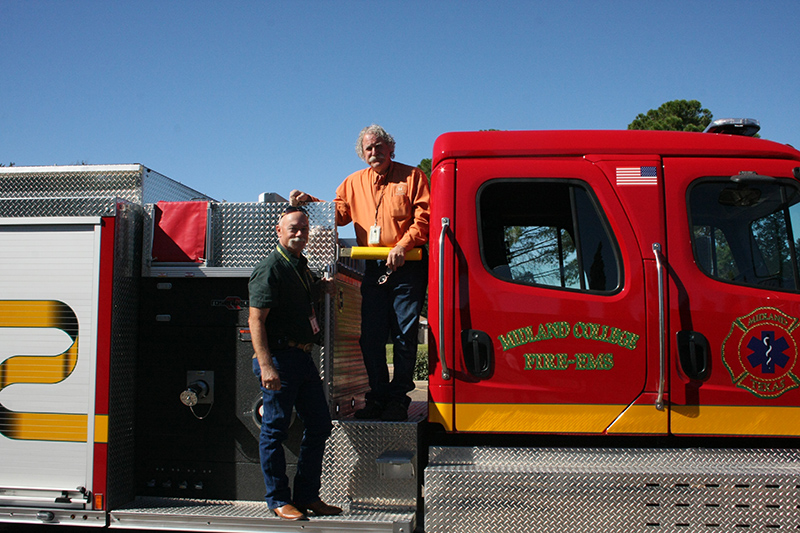 The image to use for this article. Listing image managed through RSS tab. Midland College fire truck with Fire Academy instructors Mark Kuhn and Gary Glass