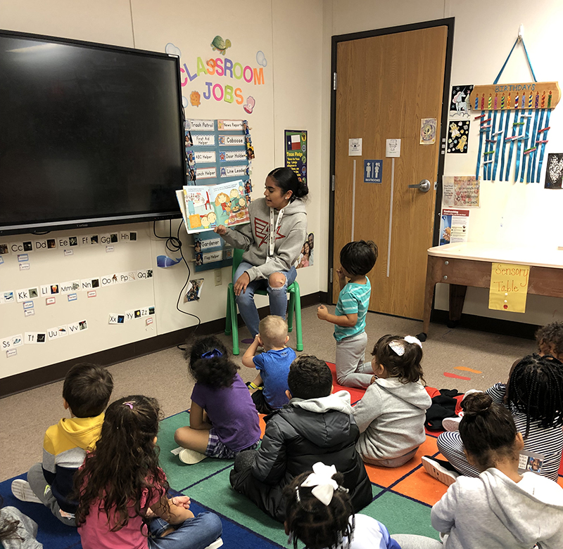 AAT student reading to pre-k students