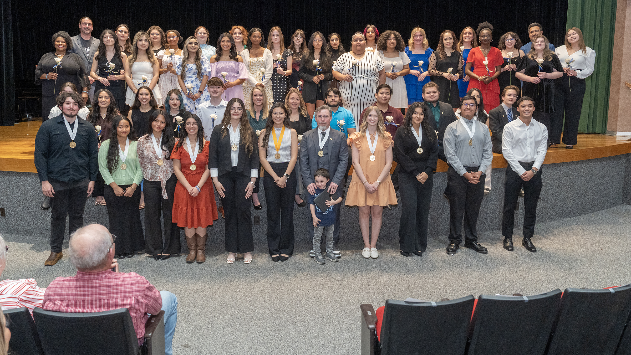 s42 Midland College students pose as they are inducted into the phi theta kappa honor society at the Allison Fine Arts Building Wagner & Brown Auditorium.